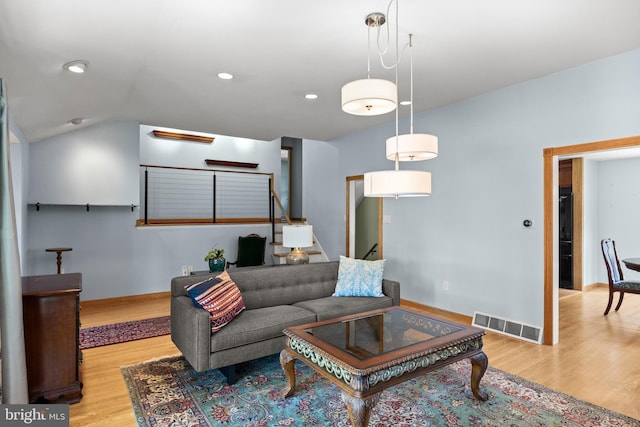 606 Hilltop Rd, Cinnaminson, NJ 08077 - living area featuring wood finished floors, stairs, recessed lighting, and vaulted ceiling
