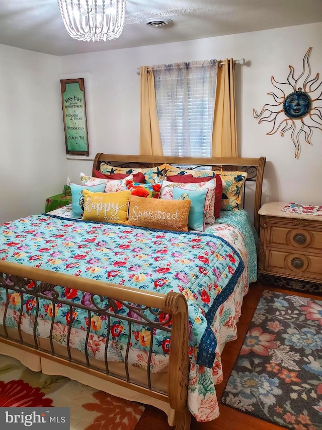 60 Branson Cove Rd, Hague, VA 22469 - bedroom featuring a chandelier