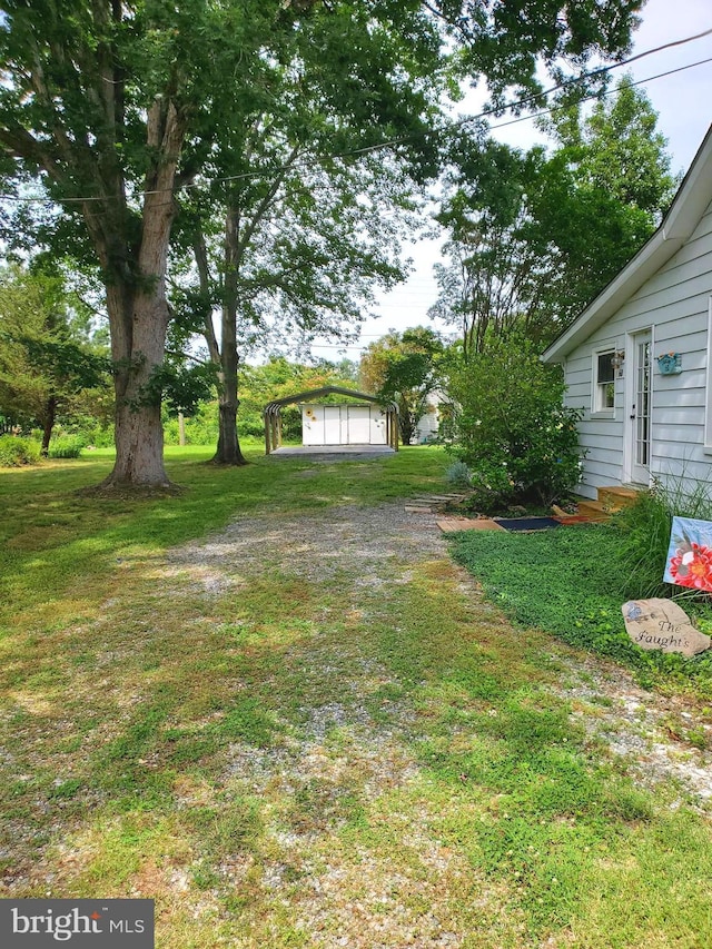 60 Branson Cove Rd, Hague, VA 22469 - view of grassy yard featuring a detached garage