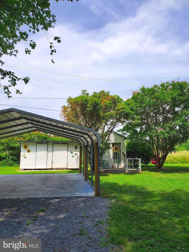 60 Branson Cove Rd, Hague, VA 22469 - view of vehicle parking featuring a detached carport and gravel driveway