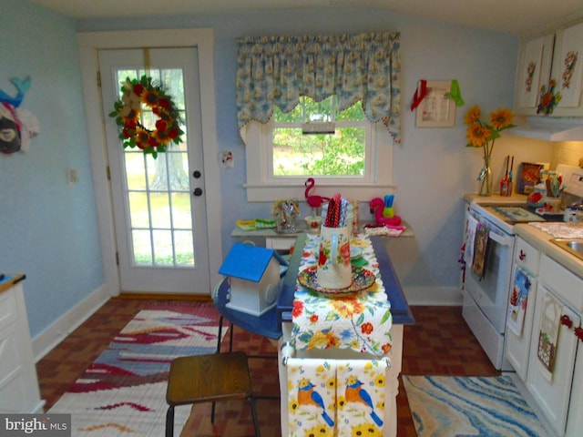 60 Branson Cove Rd, Hague, VA 22469 - kitchen with white electric stove and white cabinetry