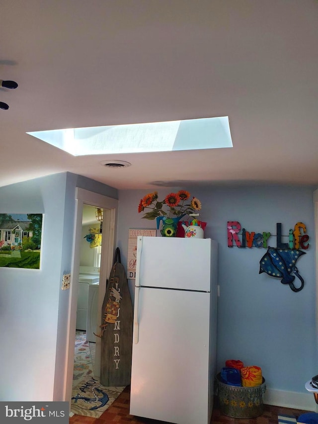 60 Branson Cove Rd, Hague, VA 22469 - kitchen with freestanding refrigerator and a skylight
