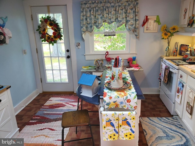 60 Branson Cove Rd, Hague, VA 22469 - kitchen featuring electric range, plenty of natural light, and white cabinetry