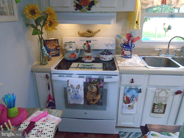 60 Branson Cove Rd, Hague, VA 22469 - kitchen featuring electric stove, white cabinetry, backsplash, and light countertops