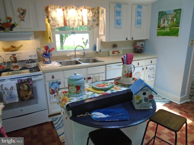 60 Branson Cove Rd, Hague, VA 22469 - kitchen with white appliances, white cabinets, light countertops, brick patterned flooring, and backsplash