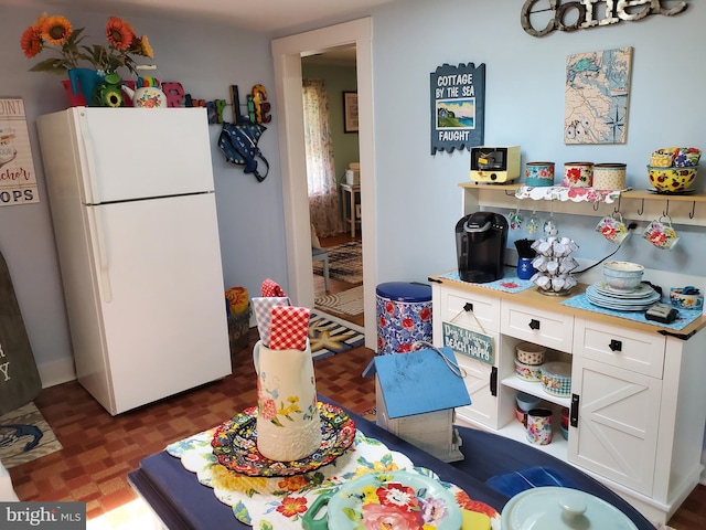 60 Branson Cove Rd, Hague, VA 22469 - kitchen with freestanding refrigerator, white cabinets, and open shelves