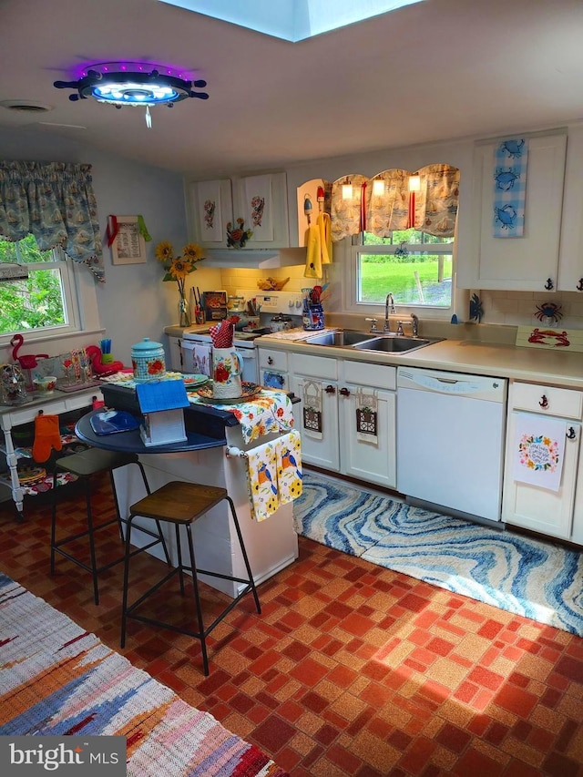 60 Branson Cove Rd, Hague, VA 22469 - kitchen with white appliances, plenty of natural light, under cabinet range hood, and white cabinetry
