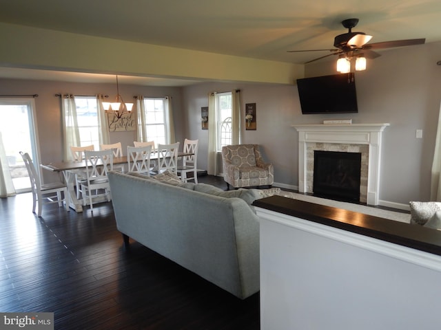 11 Rolling Ridge Dr, Milton, PA 17847 - living room featuring dark wood-style floors, ceiling fan, a premium fireplace, and plenty of natural light