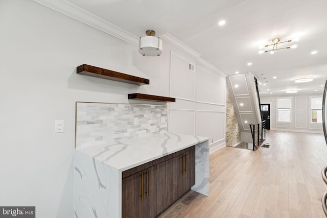 2106 E Somerset St, Philadelphia, PA 19134 - kitchen featuring open shelves, crown molding, recessed lighting, tasteful backsplash, and light wood-style flooring