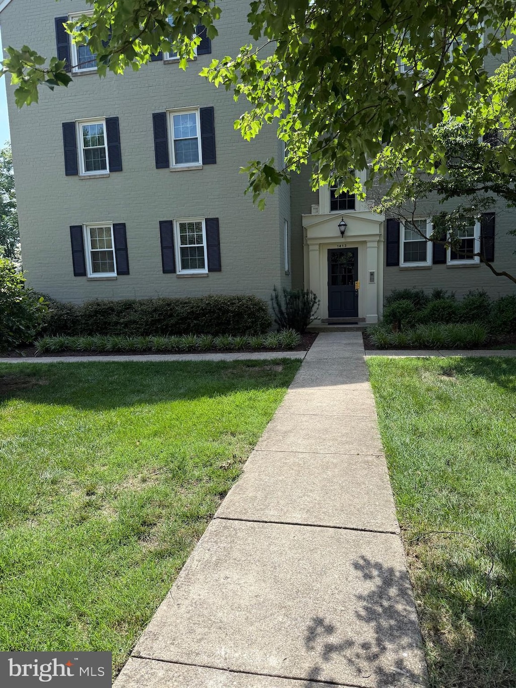 1413 Belle View Blvd Unit A1, Alexandria, VA 22307 - view of front of property featuring a front lawn and brick siding