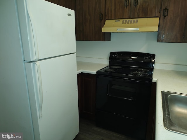 228 Canal Park Dr Unit G-208, Salisbury, MD 21804 - kitchen featuring freestanding refrigerator, black range with electric stovetop, premium range hood, and light countertops
