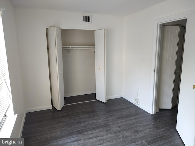 228 Canal Park Dr Unit G-208, Salisbury, MD 21804 - unfurnished bedroom with dark wood-type flooring and a closet