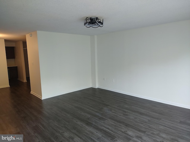 228 Canal Park Dr Unit G-208, Salisbury, MD 21804 - empty room featuring dark wood-type flooring and baseboards