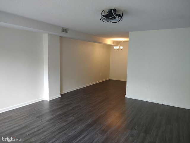228 Canal Park Dr Unit G-208, Salisbury, MD 21804 - spare room with a chandelier and dark wood-style floors
