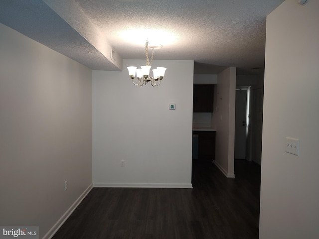 228 Canal Park Dr Unit G-208, Salisbury, MD 21804 - unfurnished room with wood finished floors, a chandelier, and a textured ceiling