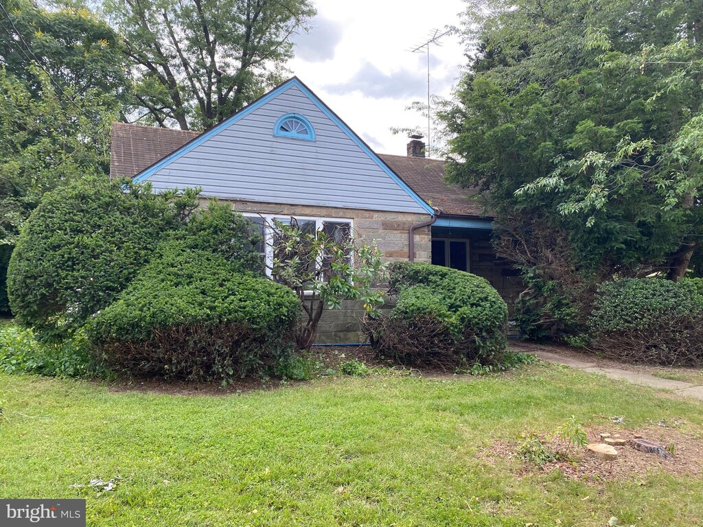 920 Brandt Ave, New Cumberland, PA 17070 - view of home's exterior with a yard and a chimney
