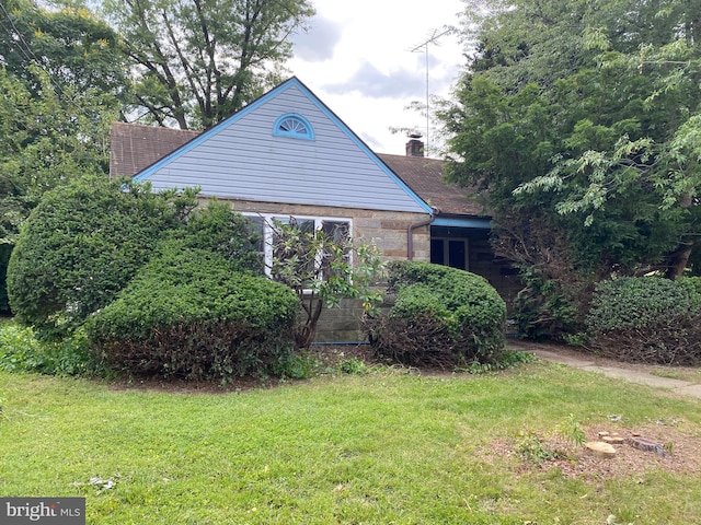 920 Brandt Ave, New Cumberland, PA 17070 - view of home's exterior with a yard and a chimney