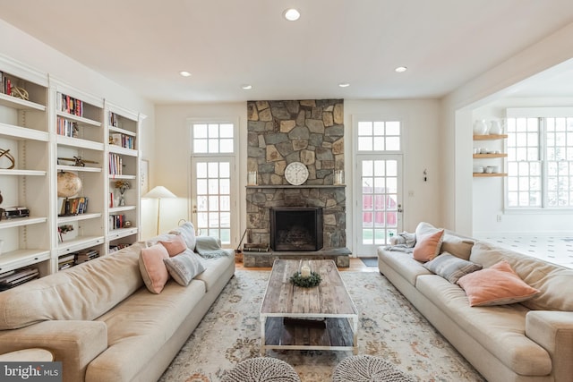 10513 Democracy Ln, Potomac, MD 20854 - living area featuring healthy amount of natural light, a stone fireplace, and recessed lighting