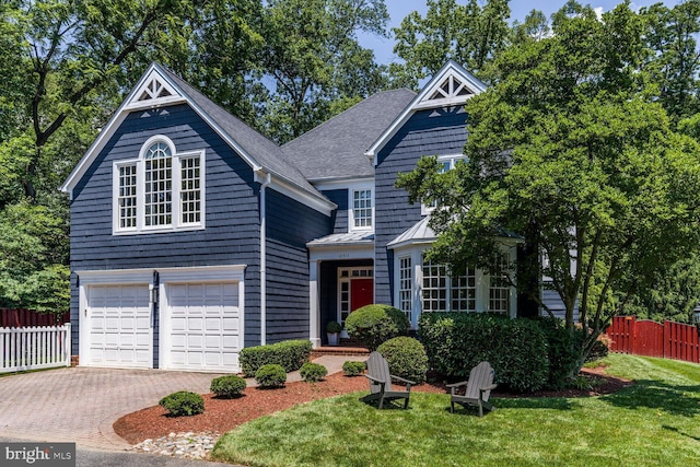 10513 Democracy Ln, Potomac, MD 20854 - view of front of home with a standing seam roof, a garage, decorative driveway, a metal roof, and a shingled roof