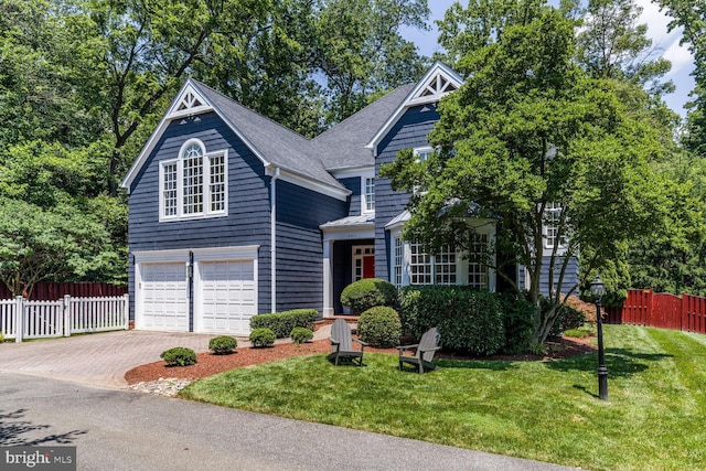 10513 Democracy Ln, Potomac, MD 20854 - view of front facade featuring an attached garage, driveway, and a shingled roof