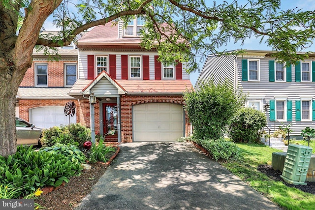 839 Marjory Ter, Lancaster, PA 17603 - view of front of property with a garage, asphalt driveway, and brick siding