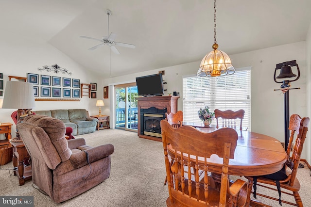 414 Riverview Rd, Forked River, NJ 08731 - dining space with carpet floors, ceiling fan, lofted ceiling, a chandelier, and a glass covered fireplace