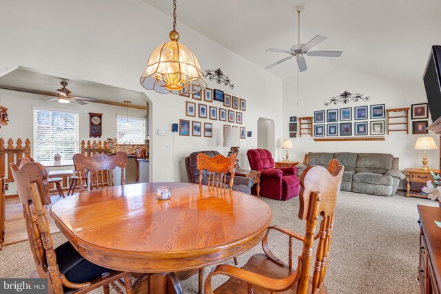 414 Riverview Rd, Forked River, NJ 08731 - dining area with ceiling fan, arched walkways, light carpet, a chandelier, and high vaulted ceiling