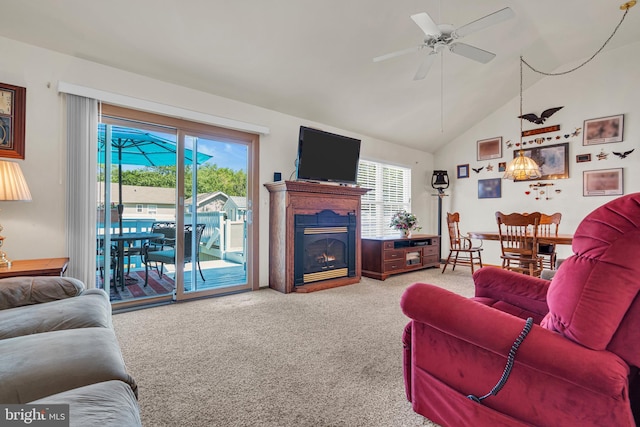 414 Riverview Rd, Forked River, NJ 08731 - living room with light colored carpet, healthy amount of natural light, a lit fireplace, a ceiling fan, and high vaulted ceiling