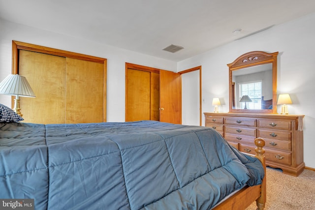 414 Riverview Rd, Forked River, NJ 08731 - bedroom featuring light colored carpet and two closets