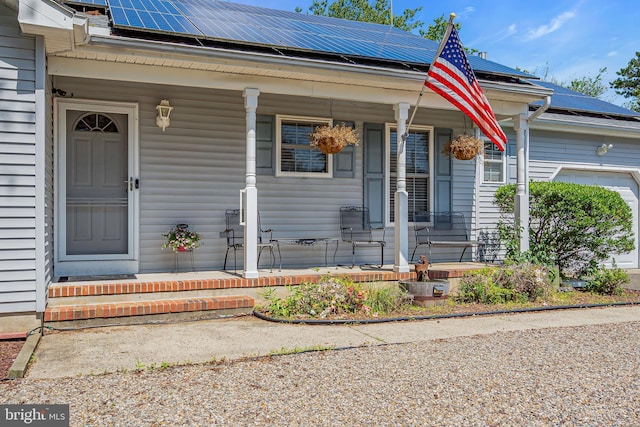 414 Riverview Rd, Forked River, NJ 08731 - property entrance featuring a porch and roof mounted solar panels