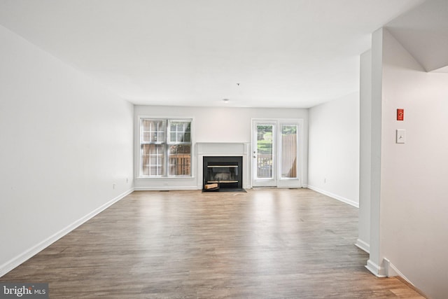 450 Hartford Sq Unit 7, West Chester, PA 19380 - unfurnished living room featuring wood finished floors and a fireplace with flush hearth