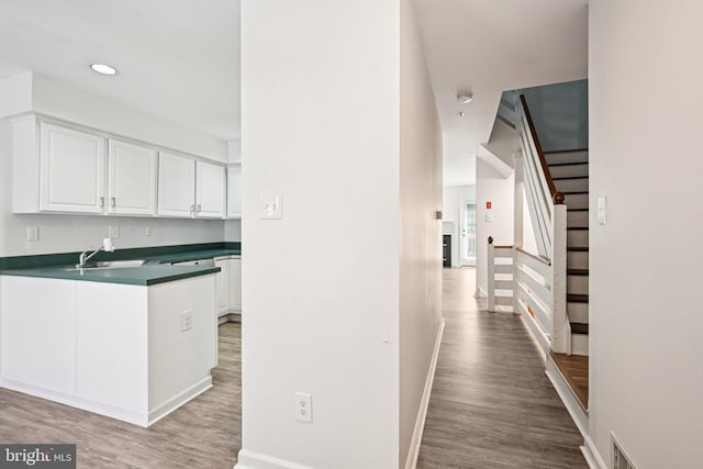 450 Hartford Sq Unit 7, West Chester, PA 19380 - hallway featuring stairway, light wood finished floors, and recessed lighting