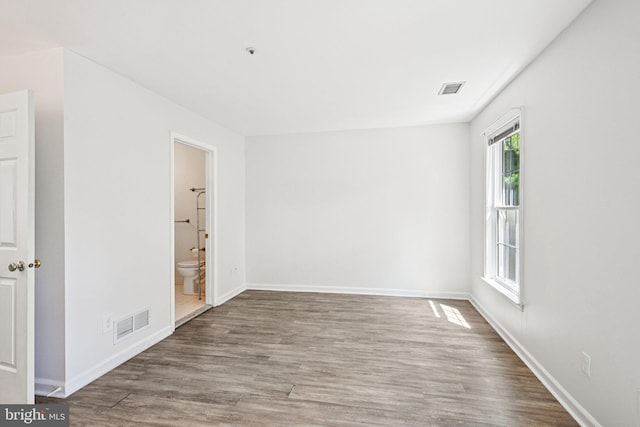 450 Hartford Sq Unit 7, West Chester, PA 19380 - spare room featuring wood finished floors and baseboards