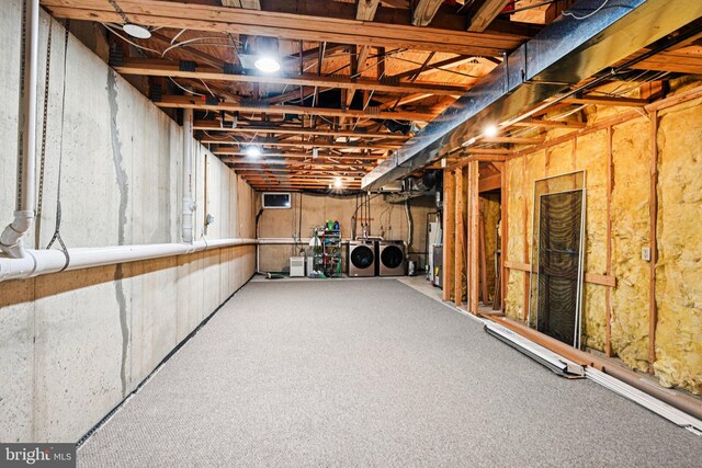 450 Hartford Sq Unit 7, West Chester, PA 19380 - unfinished basement featuring washer and dryer, carpet flooring, and water heater