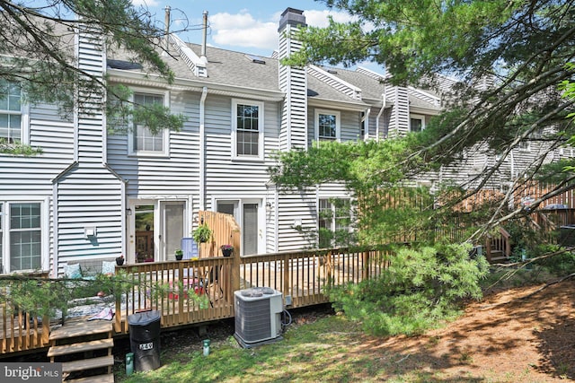 450 Hartford Sq Unit 7, West Chester, PA 19380 - back of property featuring a deck, roof with shingles, and a chimney