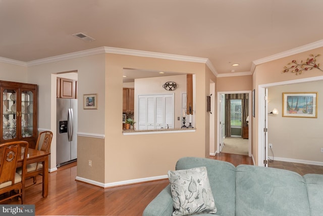637 Wallingford Rd Unit 202, Bel Air, MD 21014 - living area with wood finished floors, ornamental molding, and recessed lighting