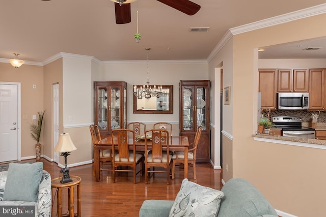 637 Wallingford Rd Unit 202, Bel Air, MD 21014 - dining space featuring wood finished floors, a ceiling fan, ornamental molding, and a chandelier