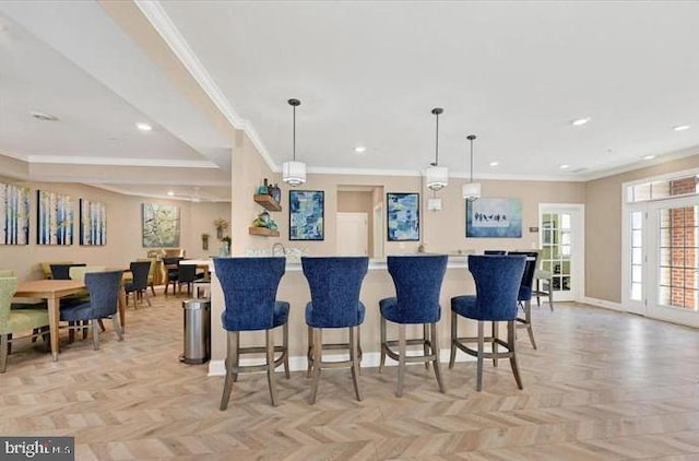 637 Wallingford Rd Unit 202, Bel Air, MD 21014 - kitchen with crown molding, a breakfast bar area, pendant lighting, recessed lighting, and light countertops
