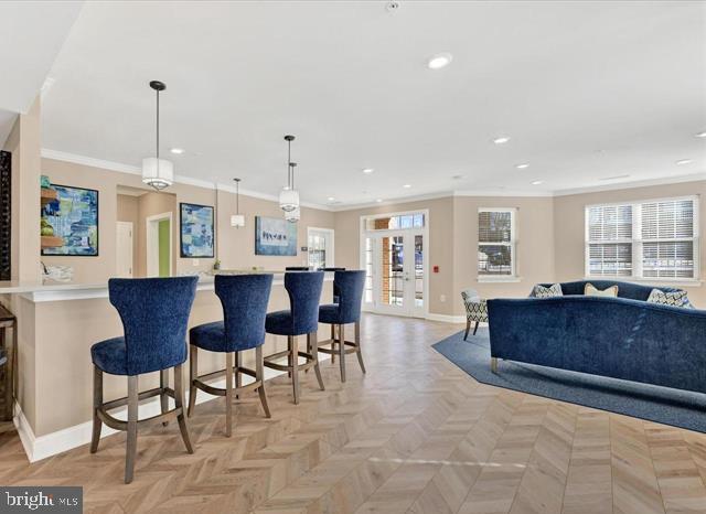 637 Wallingford Rd Unit 202, Bel Air, MD 21014 - kitchen with ornamental molding, a breakfast bar area, recessed lighting, pendant lighting, and open floor plan