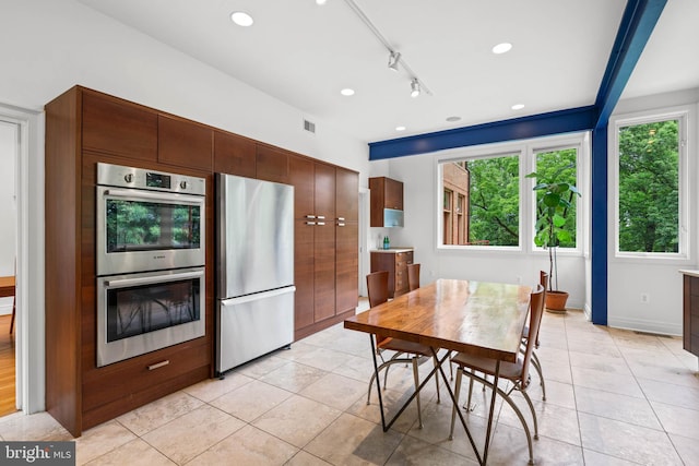 2714 Quebec St NW, Washington, DC 20008 - kitchen featuring stainless steel appliances, plenty of natural light, light tile patterned floors, and recessed lighting