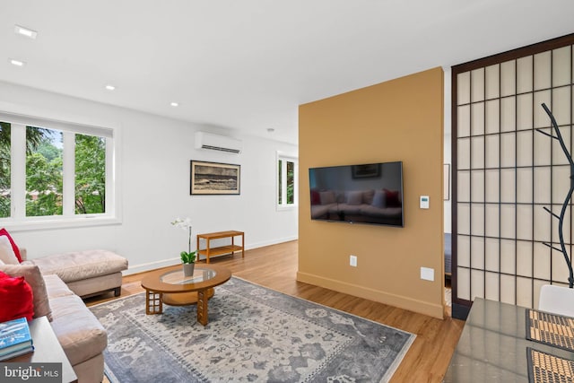 2714 Quebec St NW, Washington, DC 20008 - living area with a wall mounted AC, wood finished floors, and recessed lighting