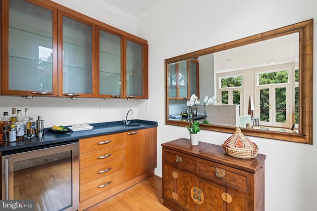 2714 Quebec St NW, Washington, DC 20008 - indoor bar with wine cooler, crown molding, and light wood-style flooring