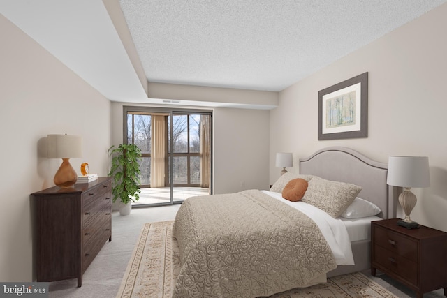 19385 Cypress Ridge Ter Unit 503, Leesburg, VA 20176 - bedroom featuring light colored carpet and a textured ceiling