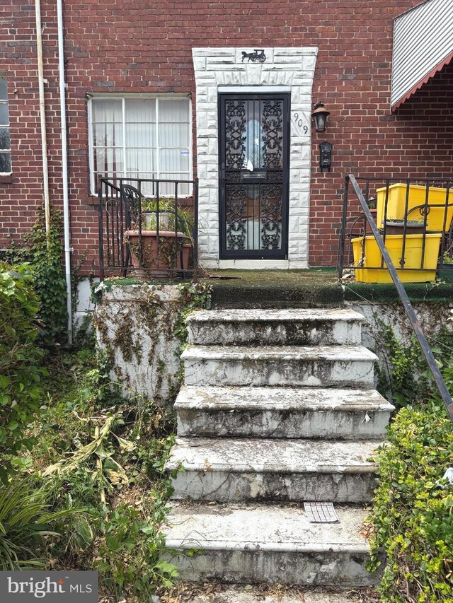909 Bonaparte Ave, Baltimore, MD 21218 - doorway to property featuring brick siding