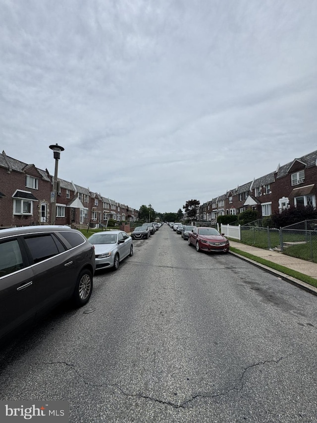 7553 Gilbert St, Philadelphia, PA 19150 - view of asphalt street featuring a residential view, sidewalks, and street lights