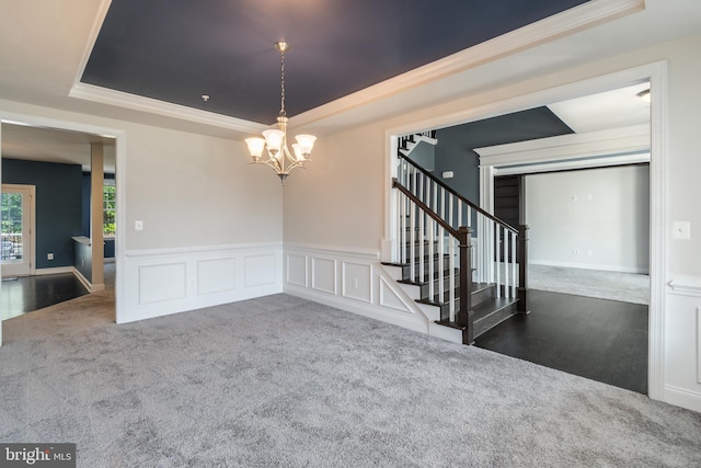 8266 Saint Francis Dr, Severn, MD 21144 - empty room with a tray ceiling, a chandelier, stairs, carpet floors, and ornamental molding