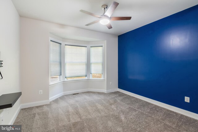 8266 Saint Francis Dr, Severn, MD 21144 - spare room featuring a ceiling fan and carpet