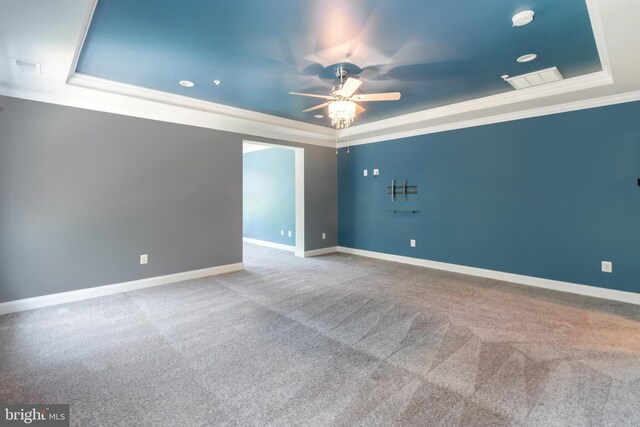 8266 Saint Francis Dr, Severn, MD 21144 - spare room with a raised ceiling, crown molding, ceiling fan, carpet flooring, and recessed lighting