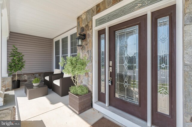 8266 Saint Francis Dr, Severn, MD 21144 - entrance to property featuring stone siding and a porch