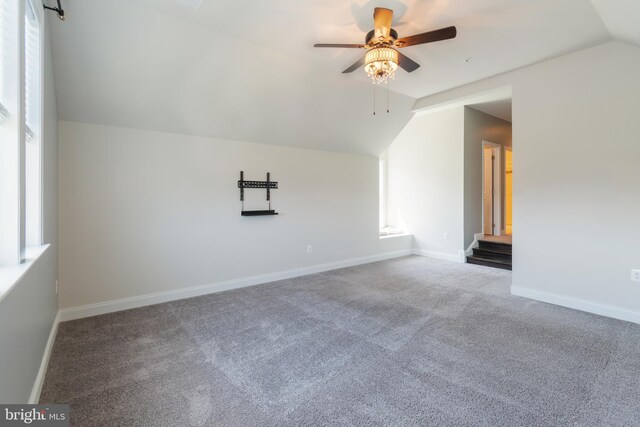 8266 Saint Francis Dr, Severn, MD 21144 - additional living space with vaulted ceiling, a ceiling fan, and carpet